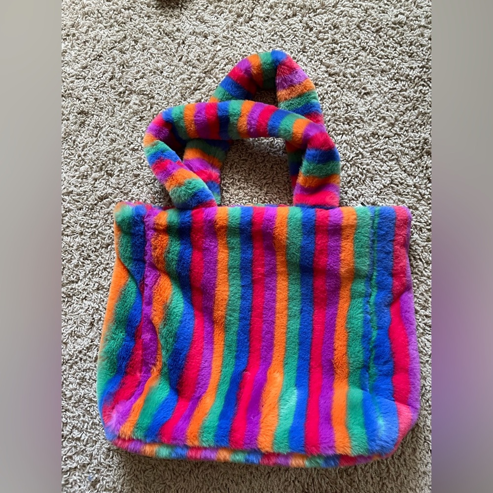 Delia’s Rainbow Striped Faux Fur from Dolls Kill tote